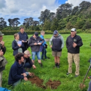 Steve Erickson, second from right, and group in pasture