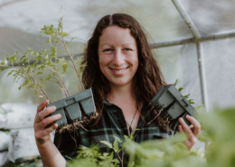 Monique Macfarlane with tomato seedlings - planting by the moon in NZ.