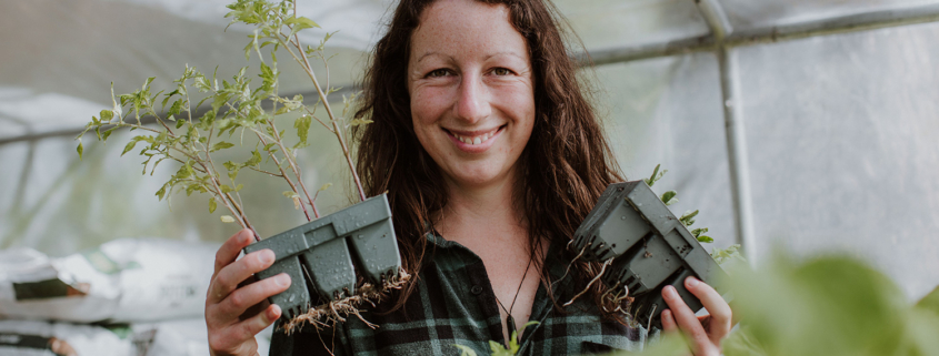 Monique Macfarlane with tomato seedlings - planting by the moon in NZ.