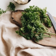 Parsley on chopping board with knife