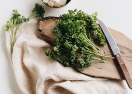 Parsley on chopping board with knife