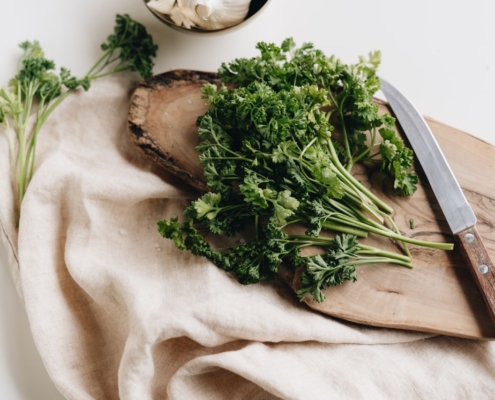 Parsley on chopping board with knife