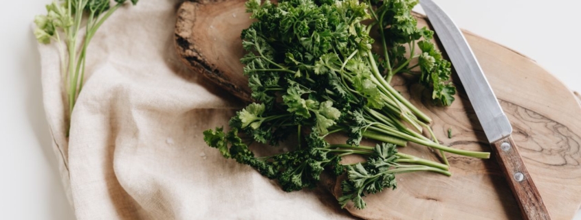 Parsley on chopping board with knife